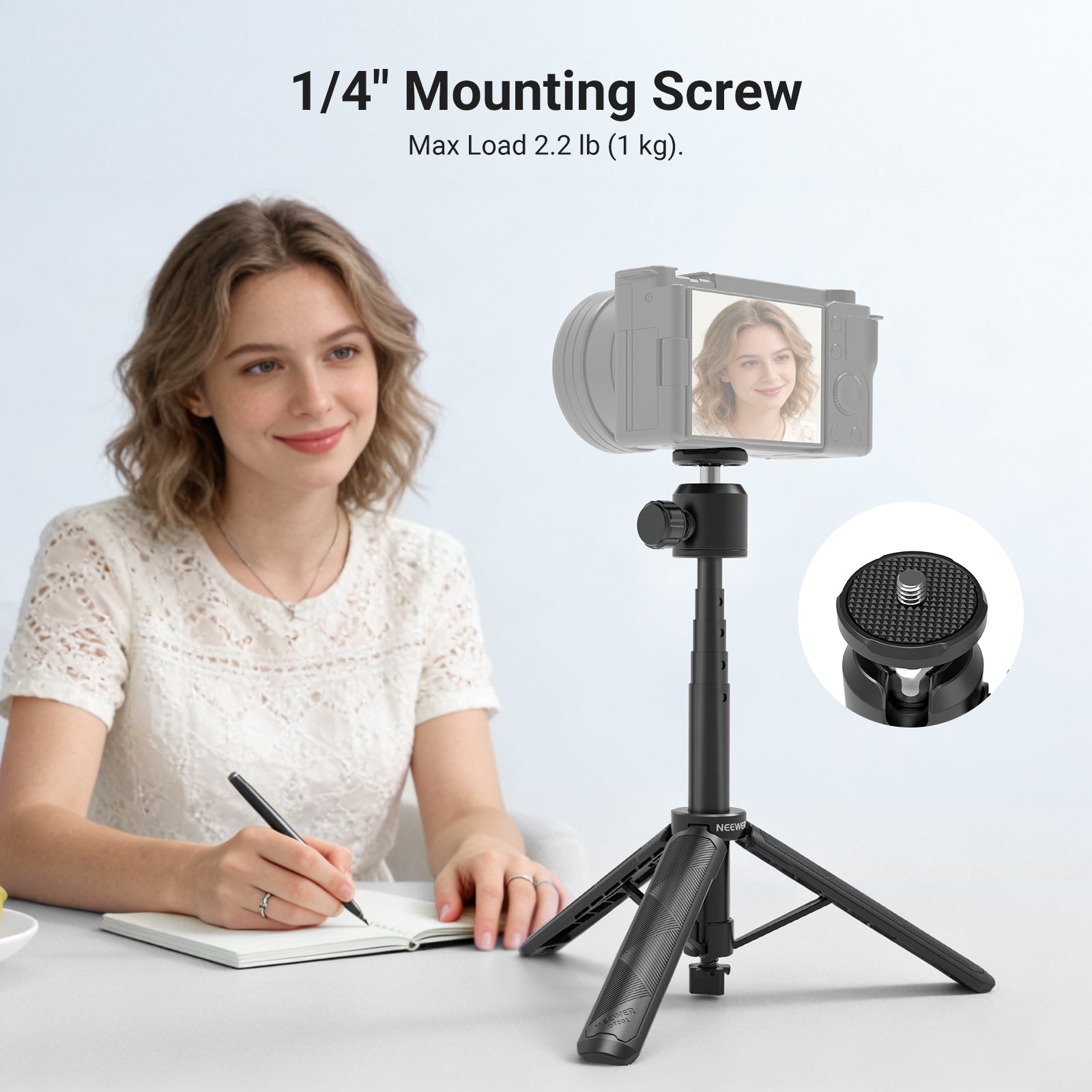 The girl holding a pen is using the NEEWER DT001 All-in-One Extendable Selfie Stick Tripod to take notes at her desk.