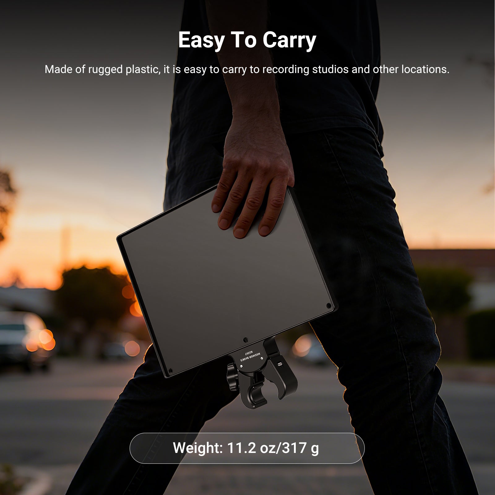 A man is holding the NEEWER MS047 Microphone Stand Tray with Crab Clamp in his hand.