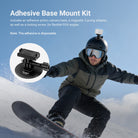 A man is using the NEEWER AC058 Adhesive Base Mount Kit on snowboards.