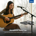 A girl playing the guitar is using the NEEWER MS047 Microphone Stand Tray to mount a microphone.