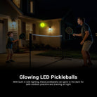 A father and son are practicing with the NEEWER PB02 LED Pickleball at night